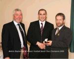 Shane McCann is presented with his Senior All Ireland Club Football medal by Sean Kelly, President GAA, included in photo on left is Padraig Prendergast Club chairman.