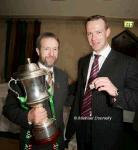David Brady holds his All Ireland Senior Medal, pictured with Sean Kelly President GAA holding the Andy Merrigan Cup at the Ballina Stephenites All Ireland Senior Club champions 2005 Victory Celebration Dinner in the Downhill House Hotel, Ballina Photo Michael Donnelly