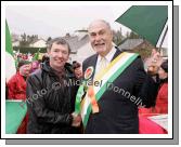 Jim Fogarty, Kiltimagh and Bob Shannon, leader of the Quaker City String Band at St Patrick's Day Parade in Kiltimagh. Photo:  Michael Donnelly