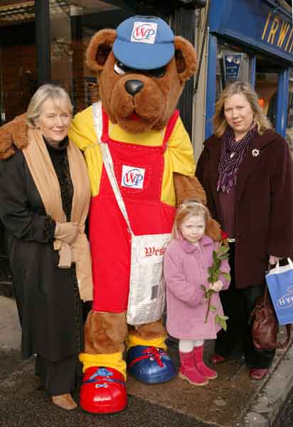 Claremorris ladies Gemma Smyth, Marianna Smyth and little Grace Carolan met Newsybear during his trip up Main St Castlebar as he handed out Roses and Chocolates. Photo Michael Donnelly.