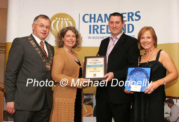 Lesley Emerson representing Ireland West (sponsors) presents the Mayo Pub of the Year award to Harry and Liz McManamon of the Graunne Uaile, Newport, on left is Owen Hughes, President Westport Chamber of Commerce. Photo:  Michael Donnelly 