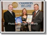 Martin Lawless of Mayo Crystal (sponsors) presents the Customer Service Award Leisure and Tourism  Sector to Catherina O'Grady Powers of Asgard Bar and Restaurant Westport, on right Owen Hughes, President Westport Chamber of Commerce. Photo:  Michael Donnelly