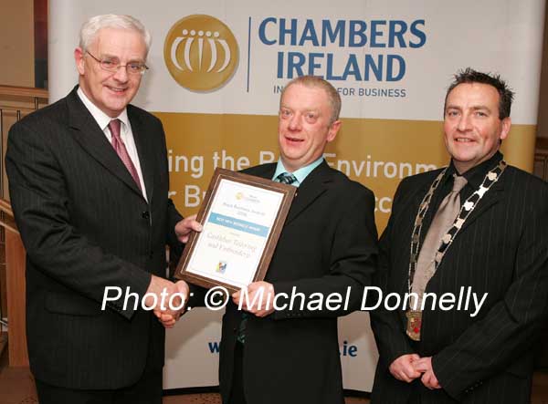 Frank Fullard CEO Mayo Enterprise Board presents Kevin MacNeely, of Castlebar Tailoring and Embroidery, winner of "Best new Business" with his award, included in photo is John Shaughnessy, Castlebar Chamber of Commerce. Photo:  Michael Donnelly